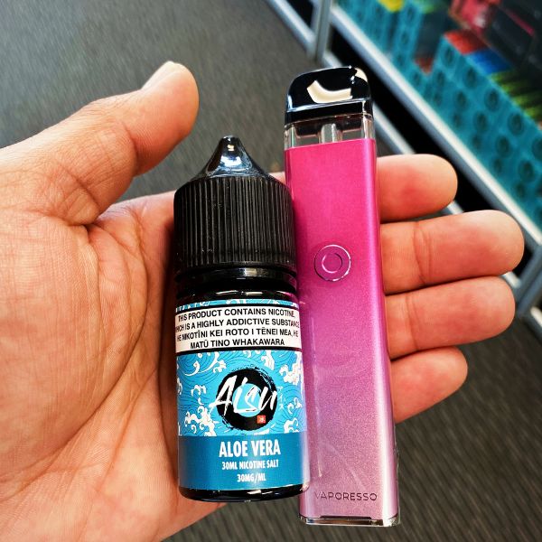 a pink vaporesso xros3 and zap aisu e-liquid