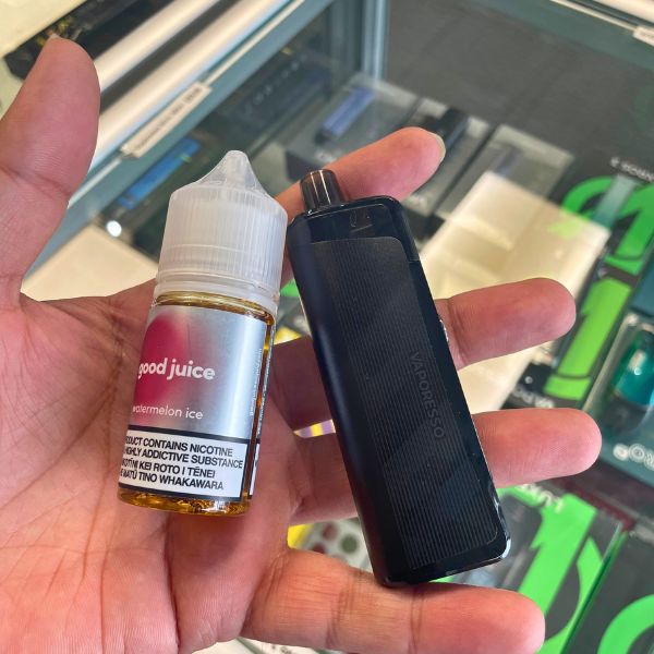 a bottle of good juice eliquid and vaporesso vape pod