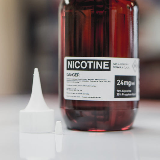 a clear bottle with red liquid of easy mix nicotine
